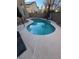 Freeform swimming pool with surrounding concrete decking at 1762 Sunflower Ct, Henderson, NV 89074