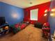 Bright bedroom with red and blue walls, featuring a Spiderman theme at 1908 W Hammer Ln, North Las Vegas, NV 89031