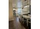 Kitchen with white cabinets, quartz countertops, and a kitchen island at 1908 W Hammer Ln, North Las Vegas, NV 89031