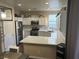 Kitchen with white cabinets, quartz countertops, and stainless steel appliances at 1908 W Hammer Ln, North Las Vegas, NV 89031