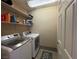 Laundry room with washer, dryer, and ample shelving at 1908 W Hammer Ln, North Las Vegas, NV 89031