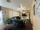 Living room with dark brown sectional sofa and built in entertainment center at 1908 W Hammer Ln, North Las Vegas, NV 89031