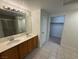 Spacious bathroom featuring dual sinks and a walk-in closet at 2001 Jasper Bluff St # 102, Las Vegas, NV 89117