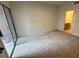 Spacious bedroom with a sliding door and a glimpse of an en-suite bathroom at 2001 Jasper Bluff St # 102, Las Vegas, NV 89117