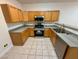 Functional kitchen with stainless steel appliances and tile flooring at 2001 Jasper Bluff St # 102, Las Vegas, NV 89117