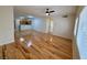 Bright living room featuring hardwood floors and abundant sunlight from windows at 2001 Jasper Bluff St # 102, Las Vegas, NV 89117