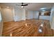 Spacious living room boasts wood floors, fan, and lots of natural light at 2001 Jasper Bluff St # 102, Las Vegas, NV 89117