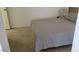 Simple bedroom with a double bed and gray bedding at 2102 E Russell Rd, Las Vegas, NV 89119