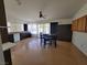 Kitchen with dark cabinets, white appliances, and dining area at 2102 E Russell Rd, Las Vegas, NV 89119