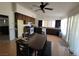 Kitchen and dining area with dark cabinets and flooring at 2102 E Russell Rd, Las Vegas, NV 89119