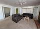 Living room with couches, coffee table and view into bedroom at 2102 E Russell Rd, Las Vegas, NV 89119