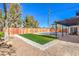 Landscaped backyard with artificial turf and a refreshing pool at 2500 W Oakey Blvd, Las Vegas, NV 89102