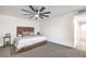 Bright bedroom featuring a comfortable king-size bed and ceiling fan at 2500 W Oakey Blvd, Las Vegas, NV 89102