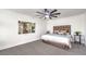 Spacious bedroom with ceiling fan, plush bedding, and large art piece at 2500 W Oakey Blvd, Las Vegas, NV 89102