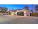 Updated mid-century home with a modern garage door at 2500 W Oakey Blvd, Las Vegas, NV 89102