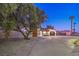 Mid-century modern home with a landscaped front yard and curved driveway at 2500 W Oakey Blvd, Las Vegas, NV 89102