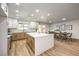 Modern kitchen with island, light wood cabinets, and a dining area at 2500 W Oakey Blvd, Las Vegas, NV 89102