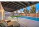 Relaxing pool area with covered patio and artificial turf at 2500 W Oakey Blvd, Las Vegas, NV 89102