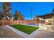 Inviting pool and patio area with artificial turf and white rock border at 2500 W Oakey Blvd, Las Vegas, NV 89102