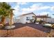 Large backyard with patio, hot tub, and gravel landscaping at 2781 Sandyfalls Way, Las Vegas, NV 89142