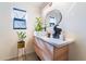 Modern bathroom with a floating vanity and a large mirror at 2781 Sandyfalls Way, Las Vegas, NV 89142