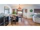 Bright dining area with a marble table and access to the backyard at 2781 Sandyfalls Way, Las Vegas, NV 89142