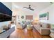 Living room with hardwood floors, neutral furniture, and city views at 2781 Sandyfalls Way, Las Vegas, NV 89142