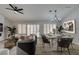 Open concept dining area with hardwood floors and a modern chandelier at 2856 Billy Casper Dr, Las Vegas, NV 89134