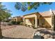 Exterior view of the home showcasing Spanish tile roof and landscaped area at 2856 Billy Casper Dr, Las Vegas, NV 89134