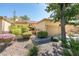 Tan stucco home with a two-car garage and desert landscaping at 2856 Billy Casper Dr, Las Vegas, NV 89134