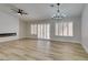 Living room features fireplace, wood-look floors, and ceiling fan at 2856 Billy Casper Dr, Las Vegas, NV 89134