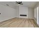 Living room with fireplace, wood-look floors, and ceiling fan at 2856 Billy Casper Dr, Las Vegas, NV 89134