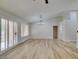 Living room with chandelier, wood-look floors, and sliding doors at 2856 Billy Casper Dr, Las Vegas, NV 89134