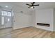 Living room with entryway view, fireplace and wood floors at 2856 Billy Casper Dr, Las Vegas, NV 89134