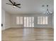 Spacious living room with hardwood floors, a ceiling fan, and sliding doors at 2856 Billy Casper Dr, Las Vegas, NV 89134