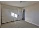 Spacious bedroom with neutral wall paint, carpet flooring and sliding door closet at 3225 Crawford St, North Las Vegas, NV 89030