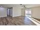 Sunlit living room featuring wood-look floors and ceiling fan at 3225 Crawford St, North Las Vegas, NV 89030