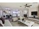 Bright living room with hardwood floors, stylish furniture, and large windows at 3225 Crawford St, North Las Vegas, NV 89030