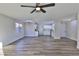 Spacious living room showcasing wood-look floors and a ceiling fan at 3225 Crawford St, North Las Vegas, NV 89030