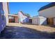 Backyard with storage shed and partially visible house at 332 Oakford St, Las Vegas, NV 89110