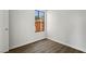 Small bedroom with wood-look flooring and a window at 332 Oakford St, Las Vegas, NV 89110