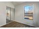 Bedroom with mirrored closet doors and wood-look flooring at 332 Oakford St, Las Vegas, NV 89110