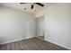 Bedroom with mirrored closet doors and wood-look flooring at 332 Oakford St, Las Vegas, NV 89110