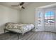 Spacious bedroom with wood-look floors and large window at 332 Oakford St, Las Vegas, NV 89110