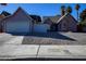 Exterior view of a single-story house with attached garage at 332 Oakford St, Las Vegas, NV 89110