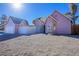 Exterior view of a lovely light pink house with a two-car garage at 332 Oakford St, Las Vegas, NV 89110