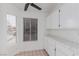 Kitchen with white cabinets, tile countertops, and window at 3606 Altar Rock Ln, North Las Vegas, NV 89032