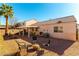 Backyard patio with seating area and fire pit at 3728 Discovery Creek Ave, North Las Vegas, NV 89031