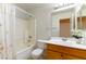 Clean bathroom with shower/tub combo and wood vanity at 3728 Discovery Creek Ave, North Las Vegas, NV 89031