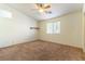 Bedroom with vaulted ceiling, ceiling fan, and neutral decor at 3728 Discovery Creek Ave, North Las Vegas, NV 89031